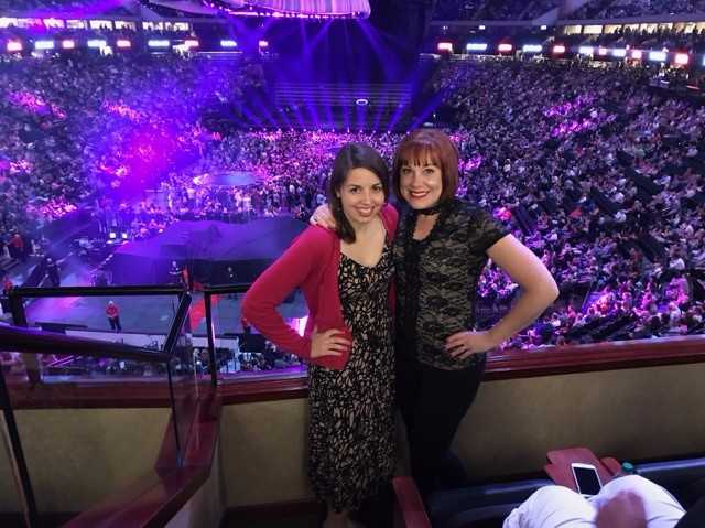 [Image is a photo of me and a friend in front of a balcony at a concert] 