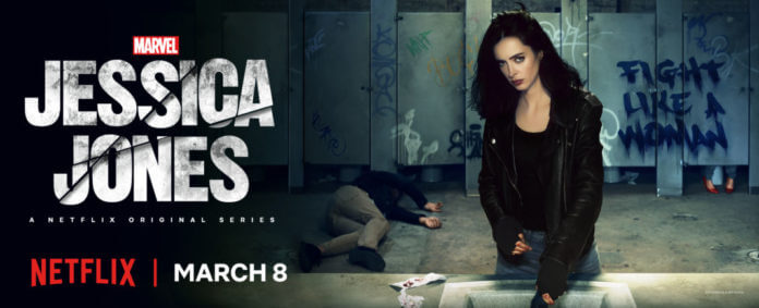 [Image shows a woman menacingly looking in front. There are gym lockers in the background with grafitti that says "Fight Like a Woman" There's a man unconscious behind her. The image reads - Marvel Jessica Jones A Netflix Original Series. Netflix | March 8th]