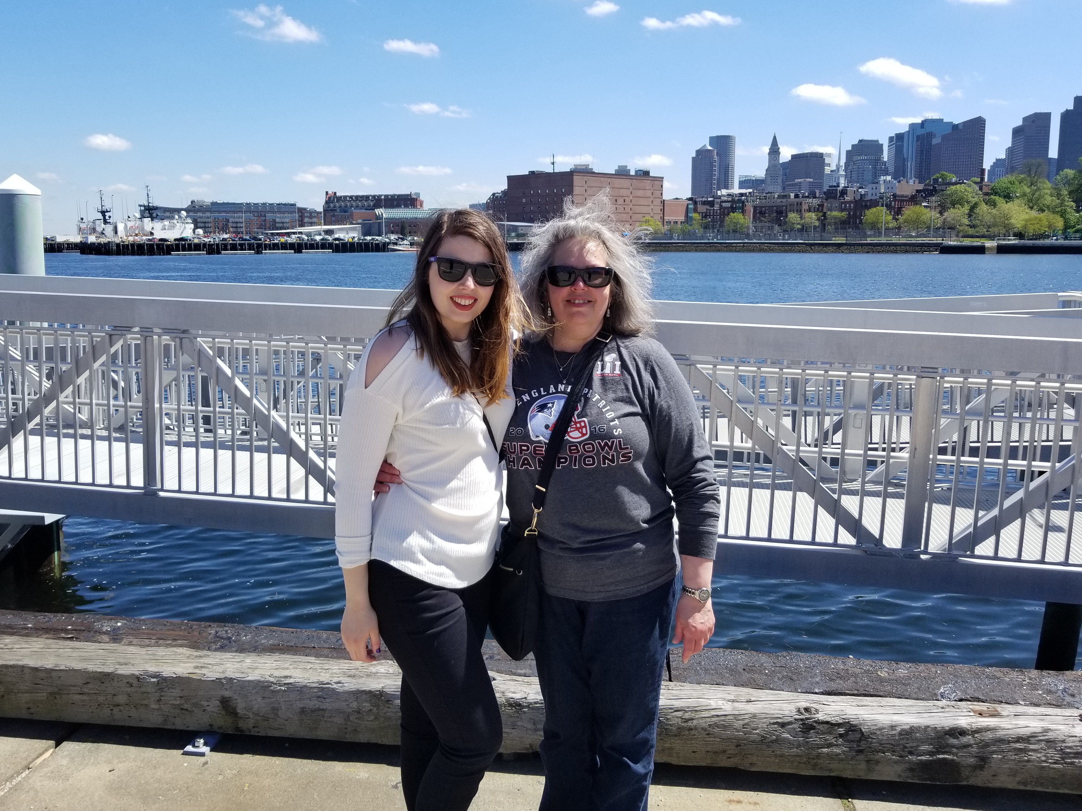 [Image is of me and my mom in front of the Boston skyline]