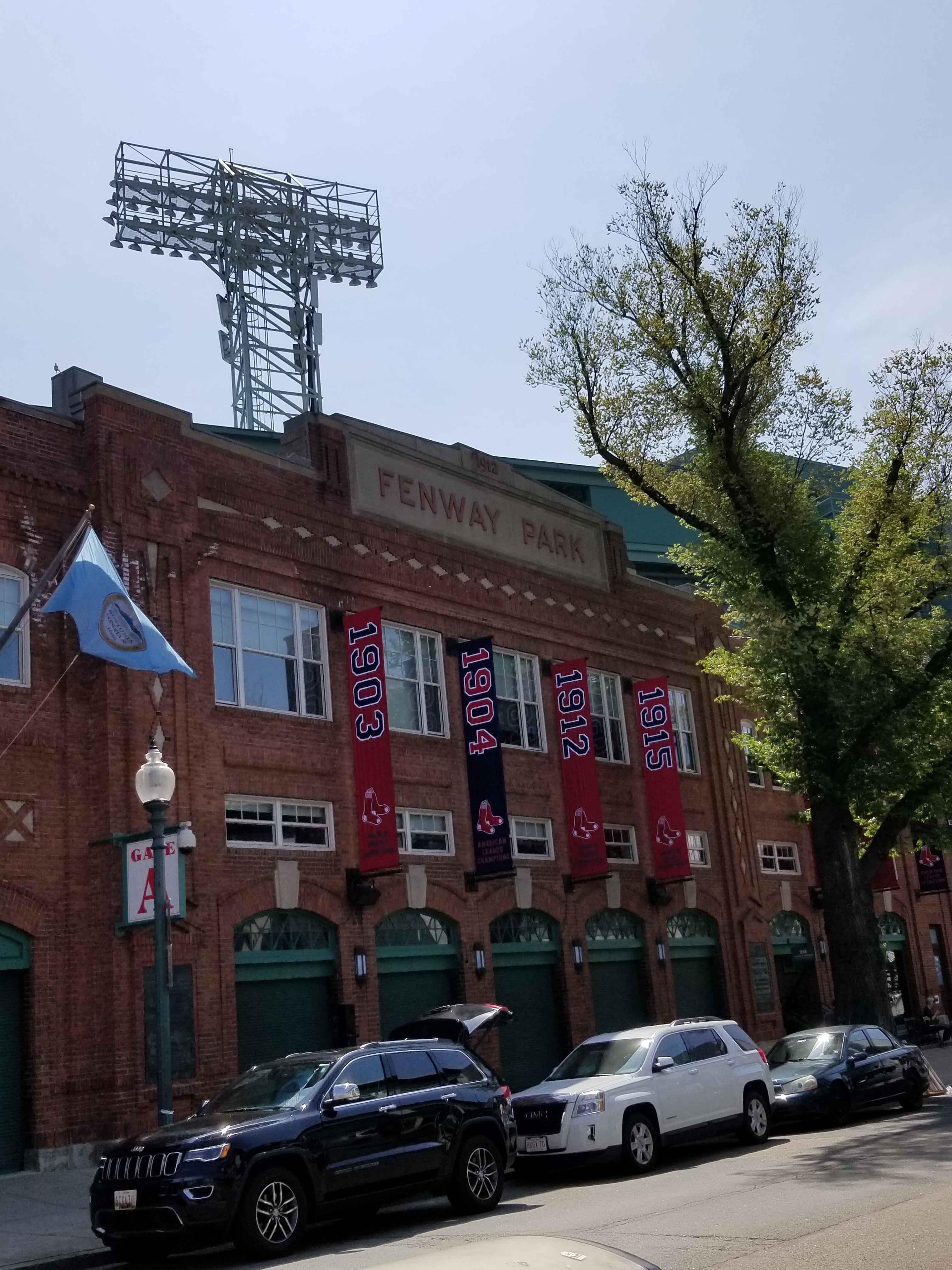 [Image is Fenway Park with several flags indicating significant years for the Boston Red Socks]