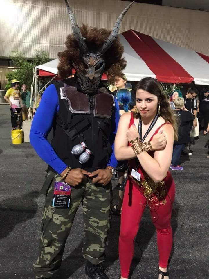 [Image is a picture of two cosplayers. One is dressed as Killmonger. The other is Donna Troy from Young Justice]