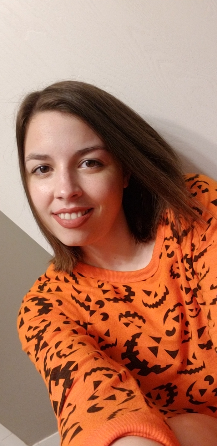 [Image is of me wearing a Jack O Lantern theme sweater]