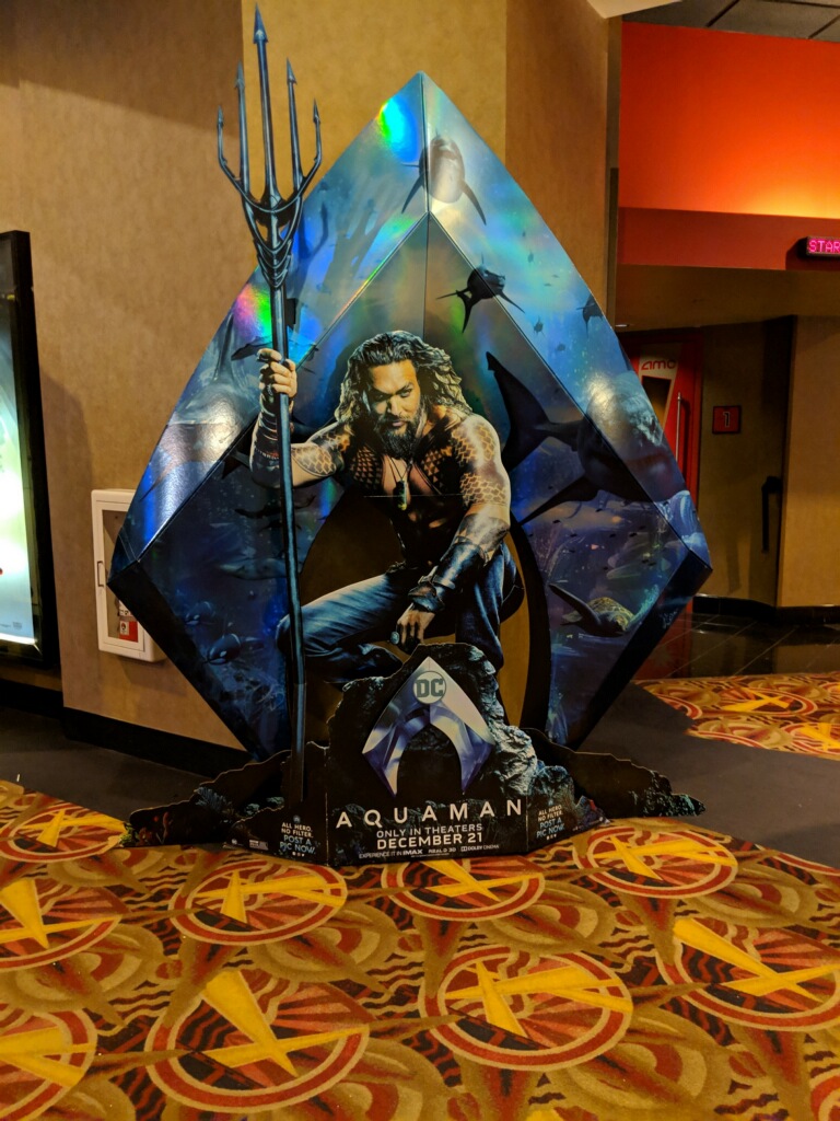 [Image is a cardboard cut out of Aquaman.]