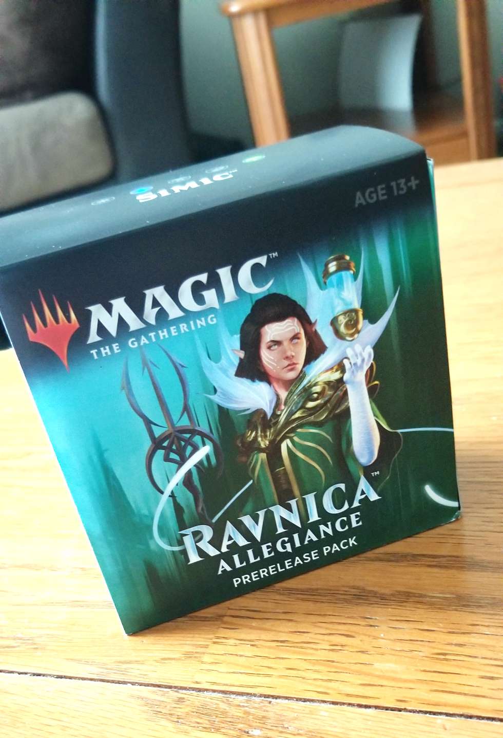 [Image is a Ravnica Allegiance pre-release pack. It's sitting on a coffee table]