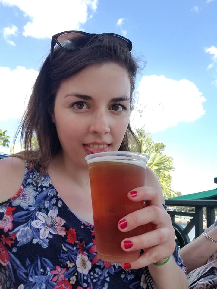 Image is a photo of me drinking a Duff beer at The Simpsons side of Universal Studios. 