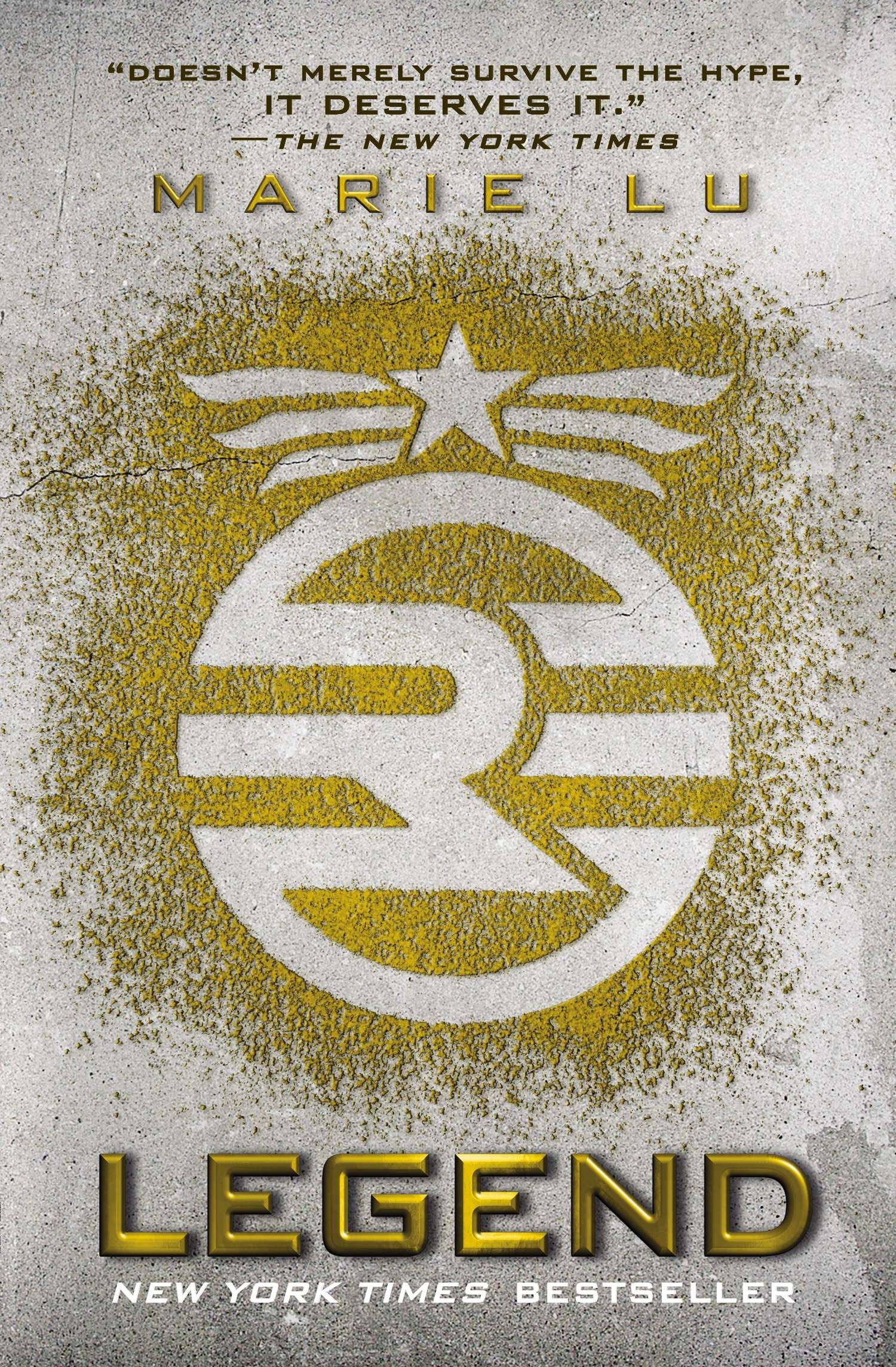 Image is for a book cover for Legend by Marie Lu. The background looks like concrete and with yellow dust a symbol is spelled out on the cover. 