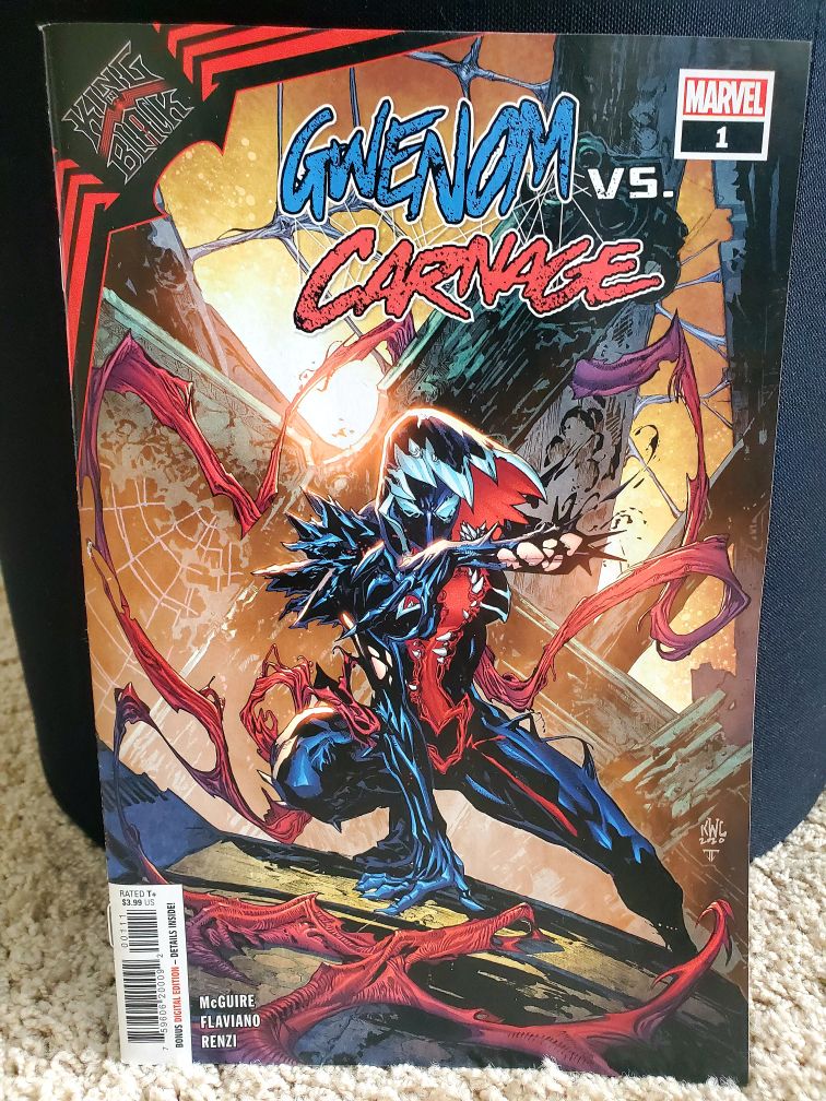 Image is a comic called Gwenom Vs. Carnage. It shows a woman posed in a side lunge with an all black suit, but it looks inky. There's hints of red. Behind her are several pillars, almost like a wreckage of a building. 