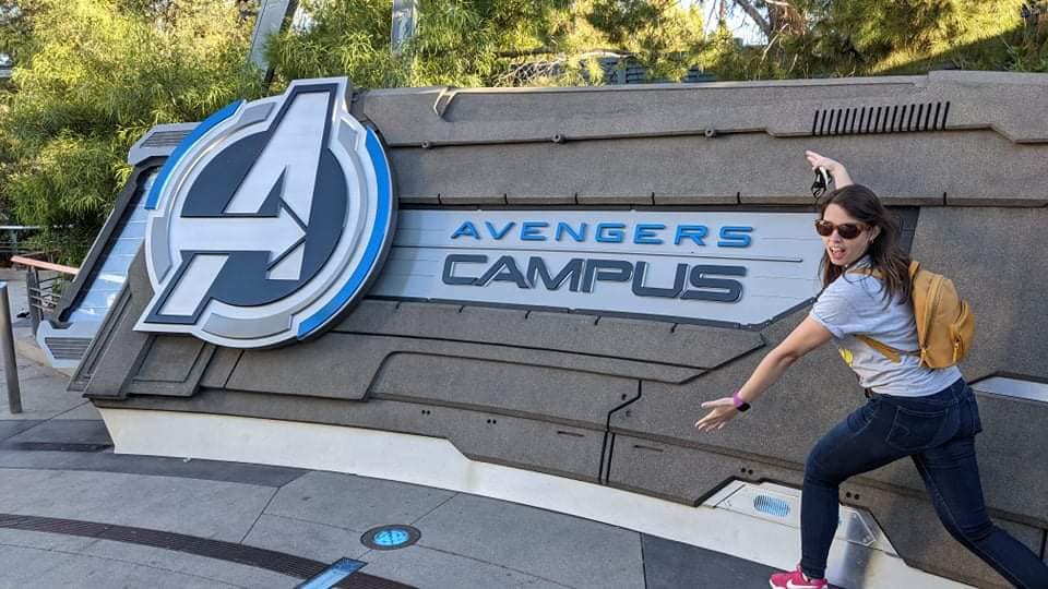 This is a photo of me standing in front of the Avengers Campus park sign. 