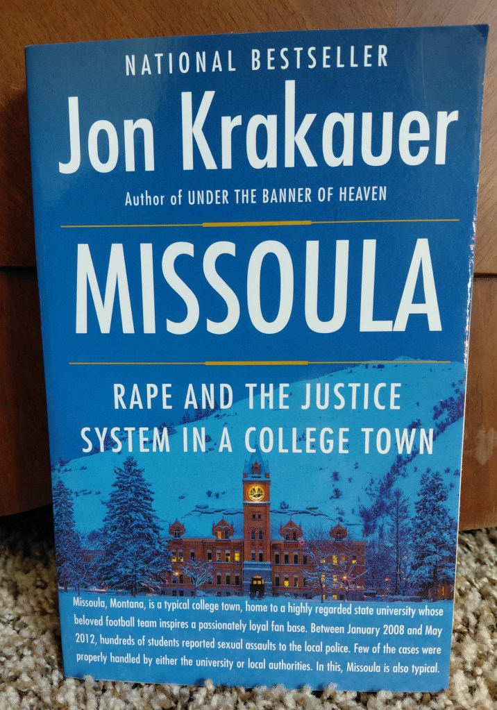 Image is a photo of a book cover that I took. The book is Missoula Rape and the Justice System in a College Town. Below it shows a beautiful red brick building and behind it is a mountain. 

At the bottom of the book it says, 

"Missoula, Montana is a typical college town, home to a highly regarded state university whose beloved football team inspires a passionately loyal fanbase. Between January 2008 and May 2012, hundreds o students reported sexual assaults to the local police. Few of the cases were properly handled by either the university or local authorities. In this, Missoula is also typical". 