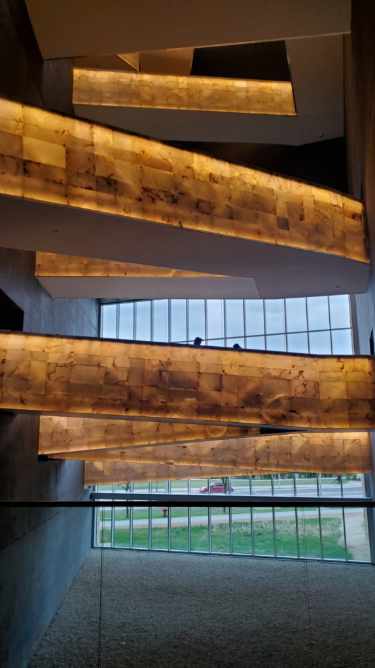 [Image shows yellow stone like walkways that proceed up the museum]