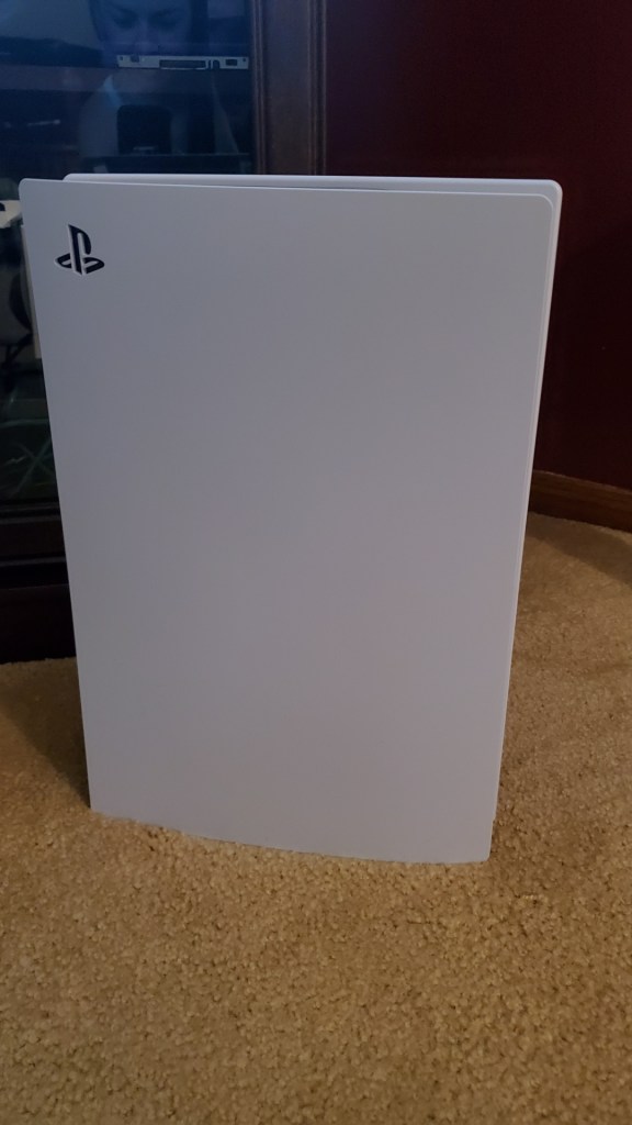 [Image is of a white rectangular box with the Playstation logo on the top left corner. It's my new PS5]
