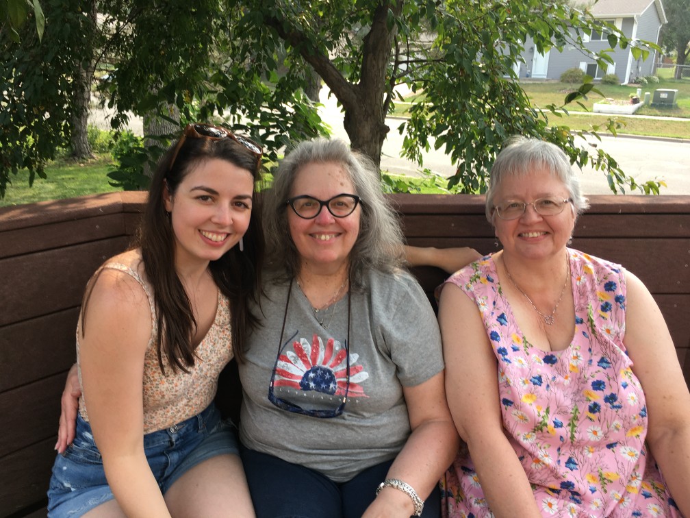 [Image is of three women smiling at the camera. I'm off to the elft, my mom is in the middle, and my aunt is to the right]
