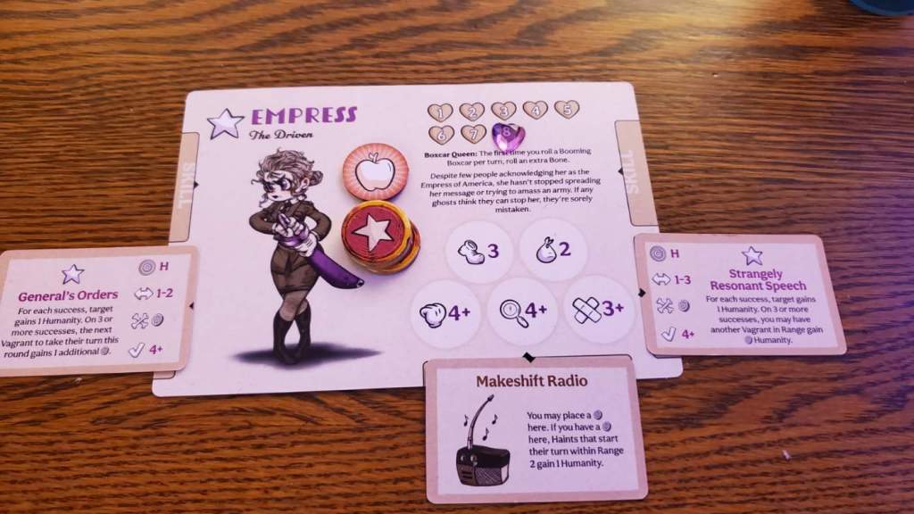 Image is a character sheet from Vagrant Song. It shows a character board. There's a cartoon like woman looking angry. She's drawing what appears to be a sword from her hip. It says at the top "Empress the Driven" with a star to the left. On the right, there are 8 hearts which indicate her health. There's some writing below that. At the bottom, it shows five skills: boot, sack, punch, investigate, and patch up. There are three mini cards next to her. There are two skills with two stars on them. There's also a Makeshift Radio below. 