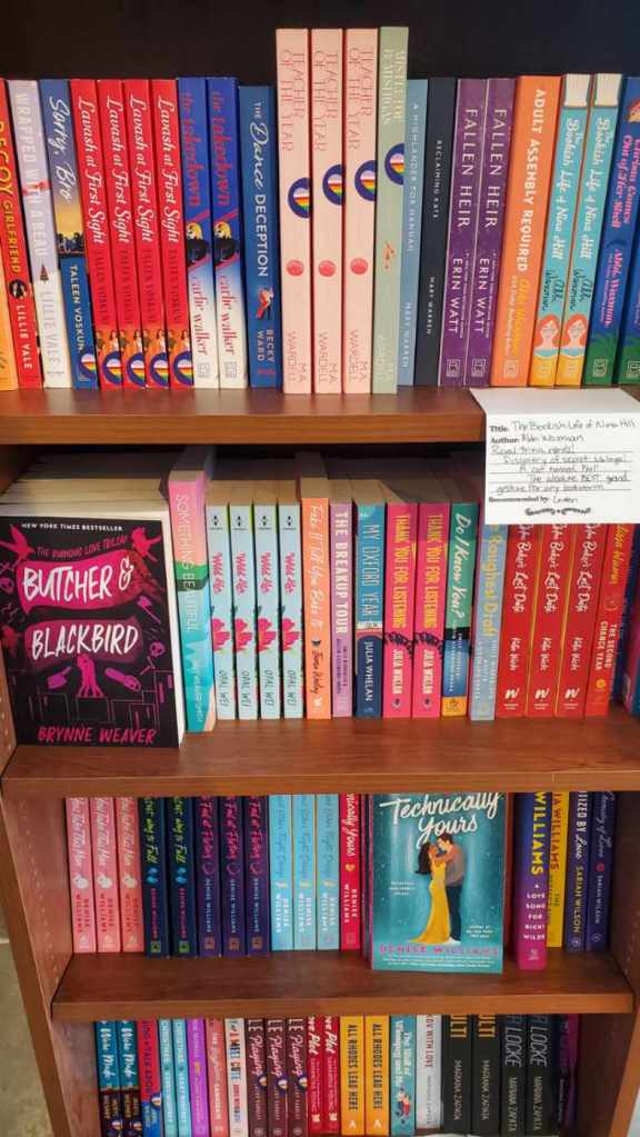 Image is a book shelf with four shelves stacked with all romance books.