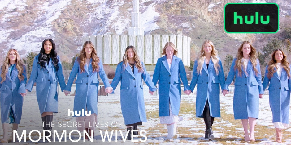 Image is a photo of eight women wearing identical blue coats. Behind them is a church. They are all holding hands. It says Hulu The Secret Lives of Mormon Wives. 