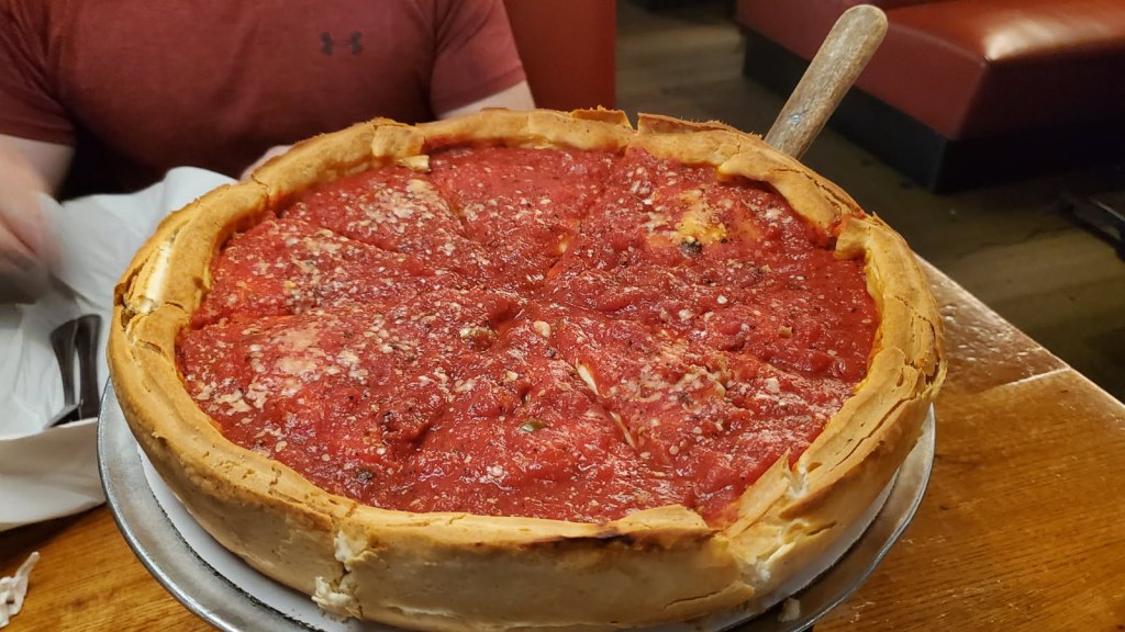 Image is a photo of a deep dish pizza. 