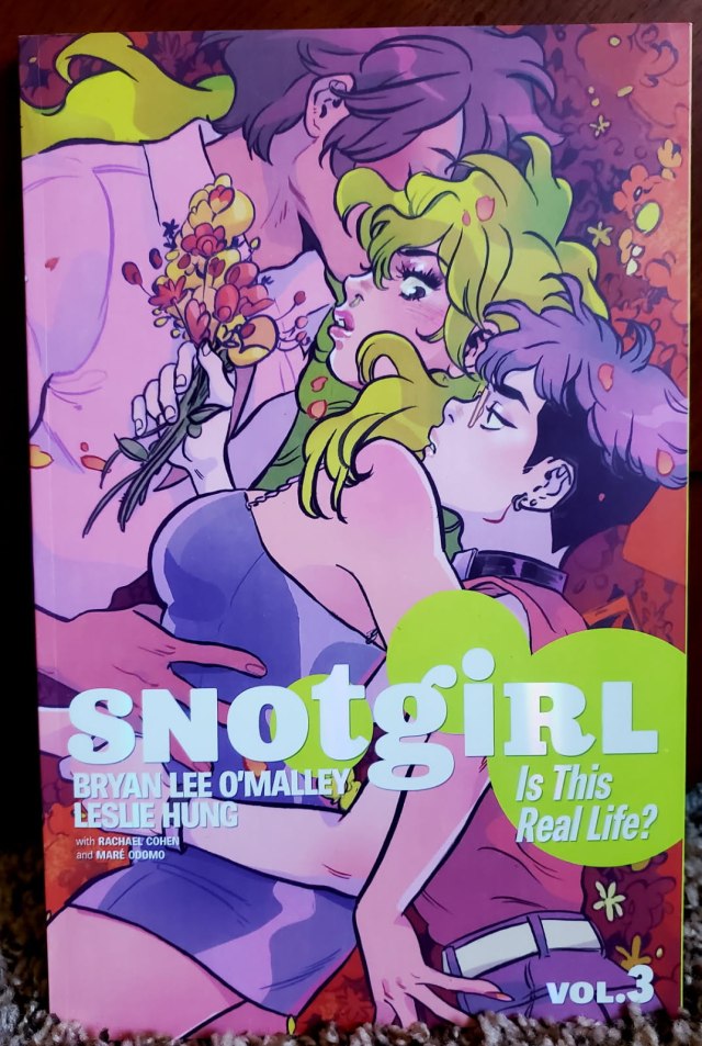 Image is a cover for the third volume of Snotgirl. It shows two men on either side of a woman. The woman is in the middle and has bright green hair. 